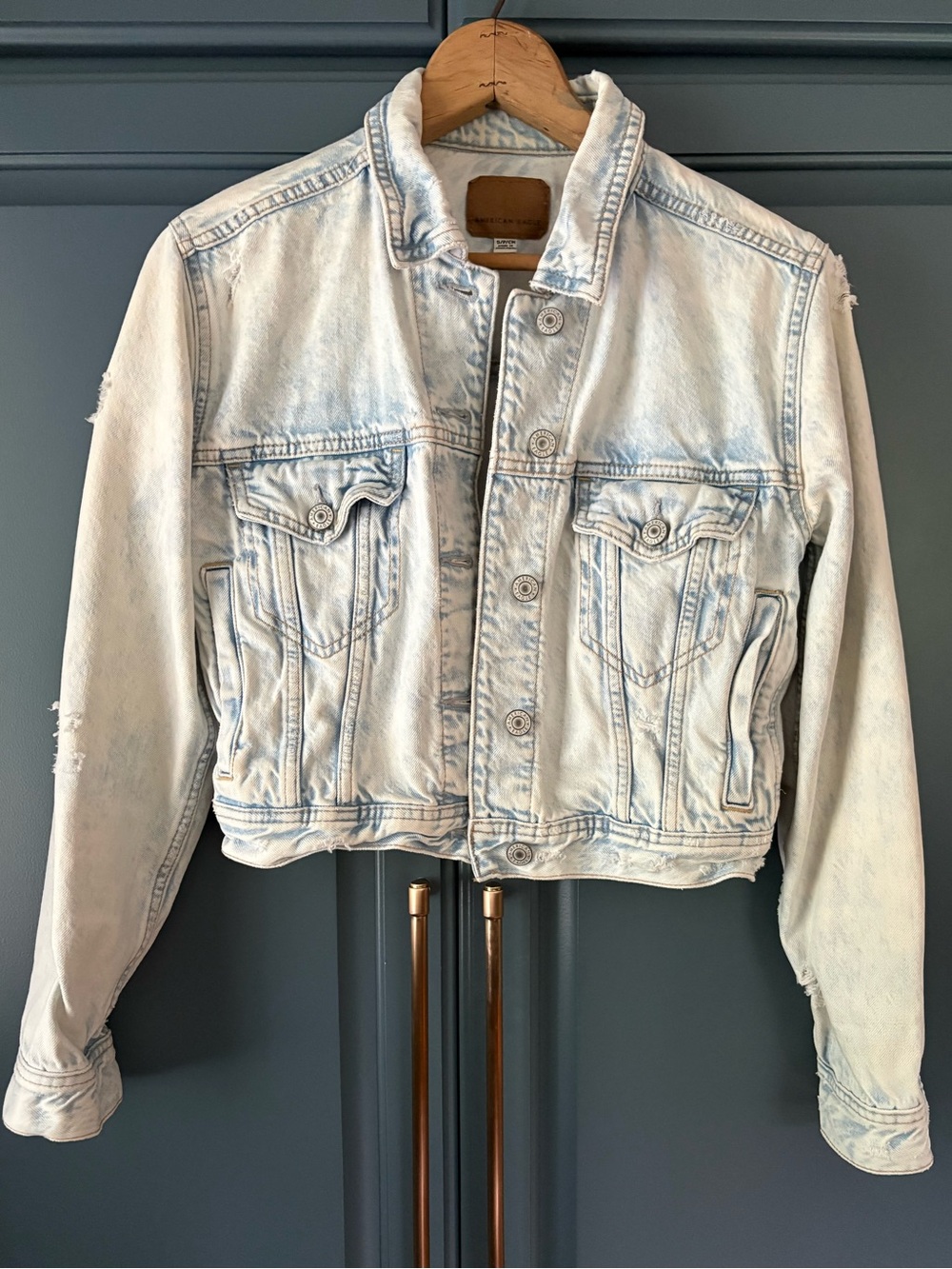 American Eagle Outfitters acid wash cropped denim jacket.